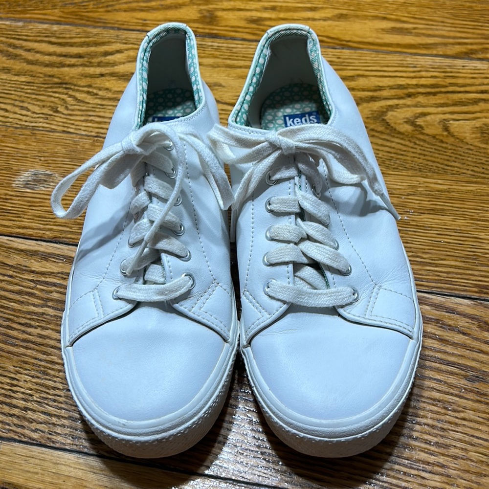 Keds white leather low top sneakers.  Size 8.  Good used condition.